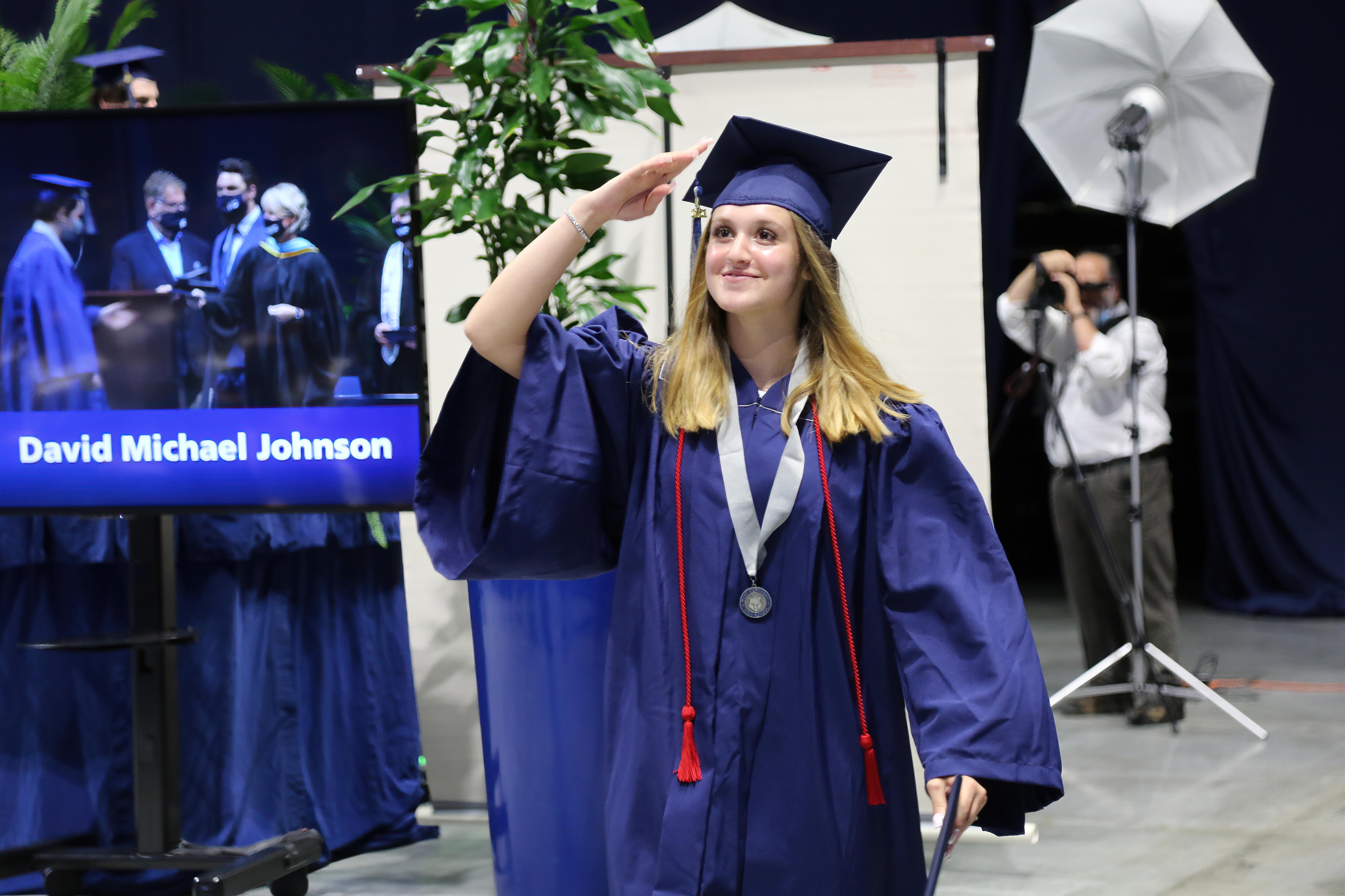Graduate saluting to the camera